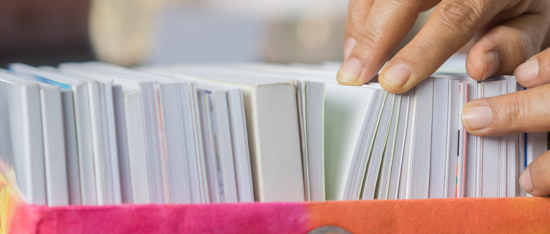 Person's hands going through paperwork