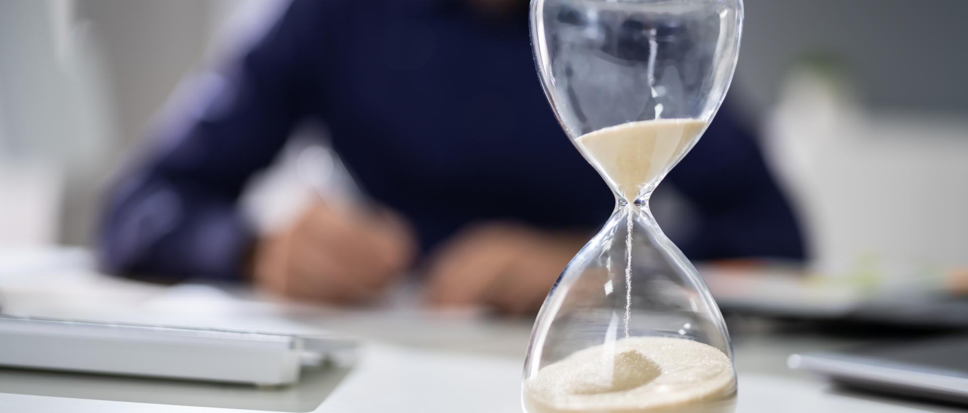 Business man with sand timer hourglass